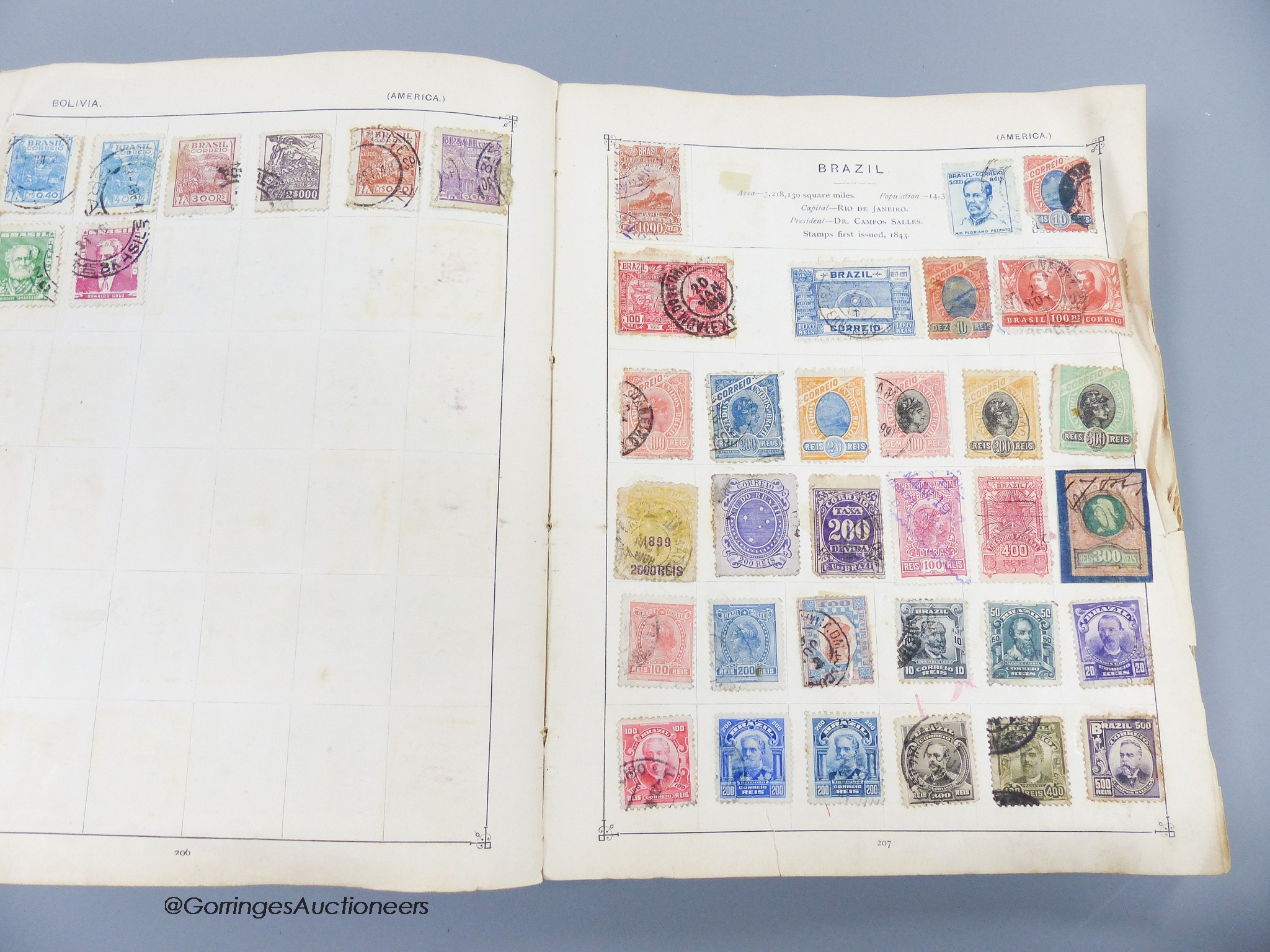 A suitcase of mostly early world stamps in albums packets with a 1937 coronation, 1945 victory album leaves, loose packets, some postal covers (affected by damp)